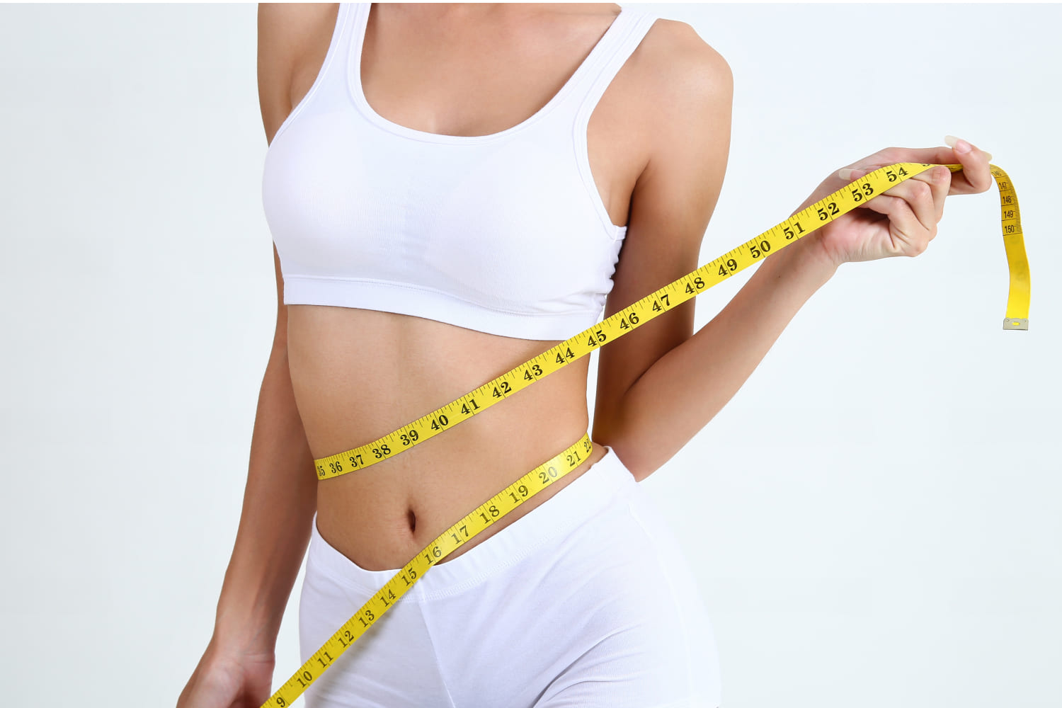 Woman showing results from metabolic health improvement